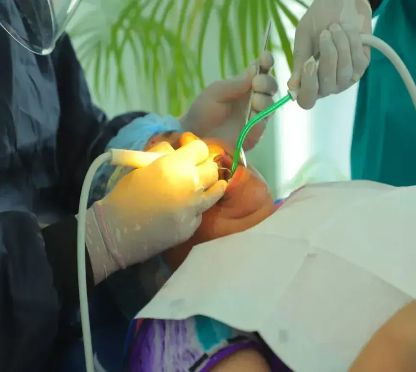 Dentist carrying out treatment on a patient at Dentonation Dental Clinic in Agra